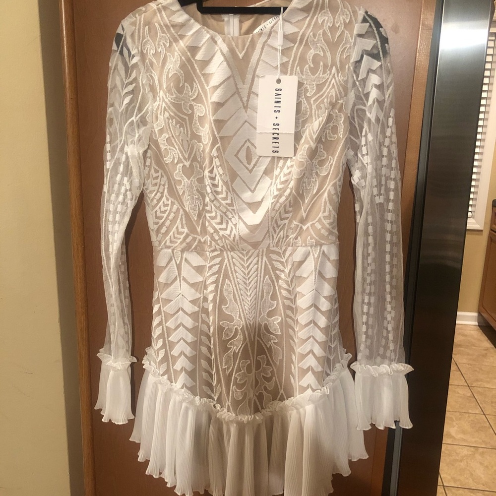 NWT. Purchased from Vici. Too short on me.